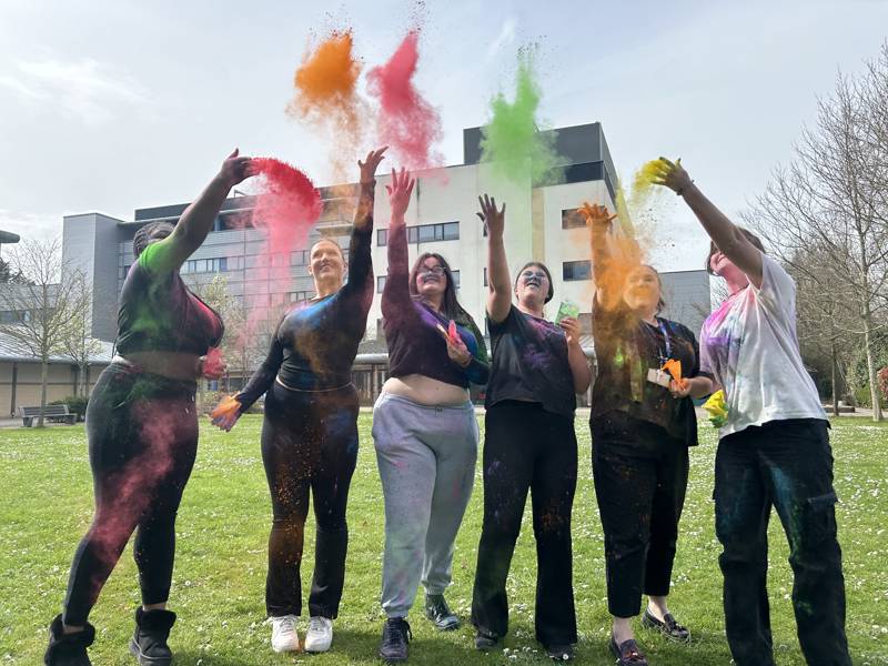 Students throwing paint to celebrate the Holi Festival