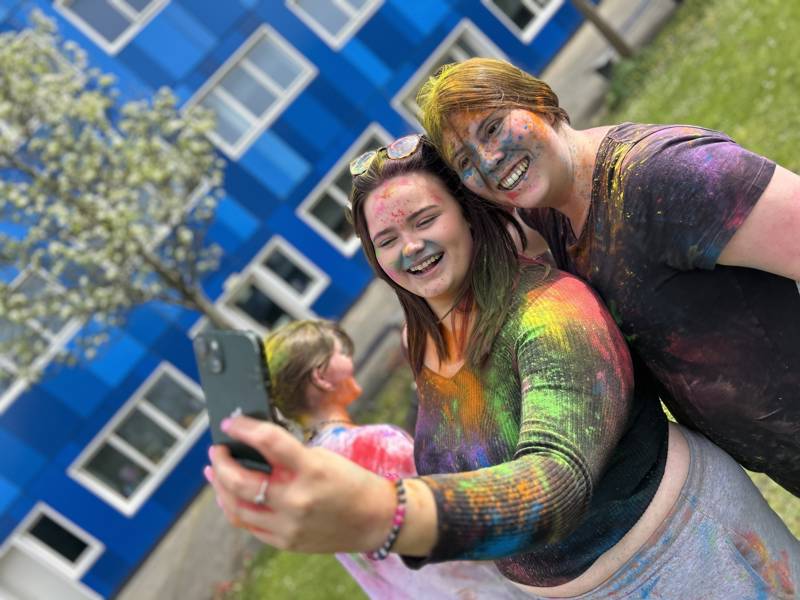 Students covered in paint for the Holi Festival